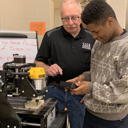 Mark Bosworth, Industrial Technology Coordinator from the Southwestern Illinois College Granite City Campus, teaching coding for the CNC machine.